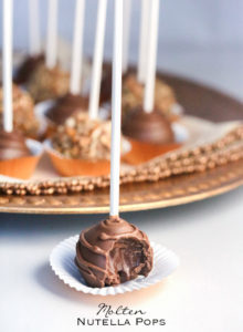 Molten Nutella Pops - Scoops of pure Nutella popped on sticks and dipped in chocolate are a fancy alternative to eating spoonfuls of Nutella straight from the jar (only 2-ingredients)