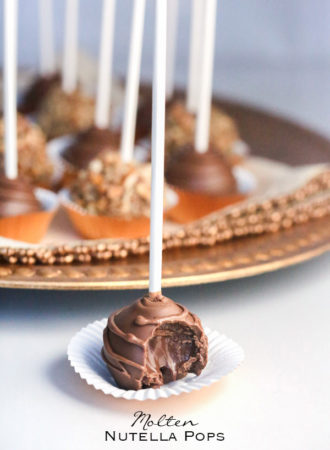 Molten Nutella Pops - Scoops of pure Nutella popped on sticks and dipped in chocolate are a fancy alternative to eating spoonfuls of Nutella straight from the jar (only 2-ingredients)