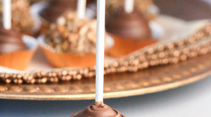 Molten Nutella Pops - Scoops of pure Nutella popped on sticks and dipped in chocolate are a fancy alternative to eating spoonfuls of Nutella straight from the jar (only 2-ingredients)