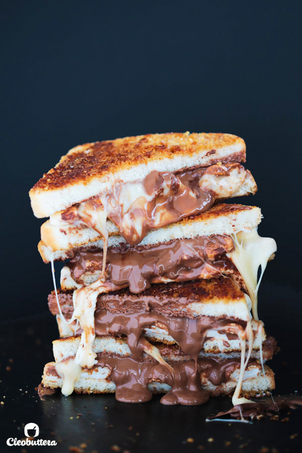 Grilled S'mores Sandwich - Graham cracker crusted bread slices sandwiching gooey roasted marshmallows and melted milk chocolate. Insanely delicious!