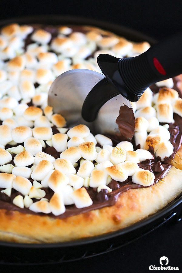 Soft pizza crust topped with Nutella, 3 types of chocolate and toasted marshmallows. This dessert pizza is a chocolate lover's dream come true.
