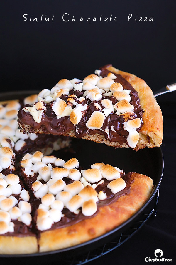 Sinful Chocolate Pizza...Soft pizza crust topped with Nutella, 3 types of chocolate and toasted marshmallows. This dessert pizza is a chocolate lover's dream come true.