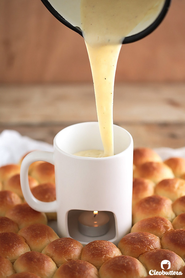 Ring around a Rolls -Bite-sized dinner rolls ring served with a cheese fondue dip. Perfect for the holidays and special occasions!