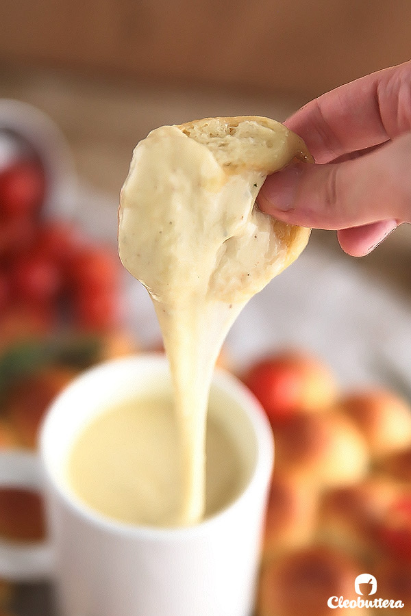 Ring around a Rolls -Bite-sized dinner rolls ring served with a cheese fondue dip. Perfect for the holidays and special occasions!