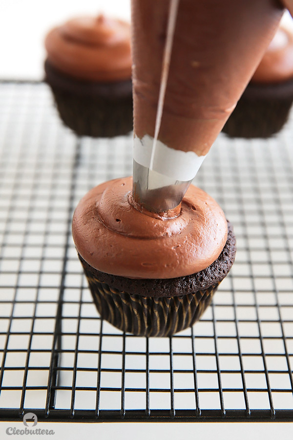 Nutella Lava Cupcakes {Exploding with Nutella flavor! These tender chocolate cupcakes have a Nutella sauce lava center and topped with the Nutella-iest frosting you will ever meet, that does NOT having a speck of powdered sugar}