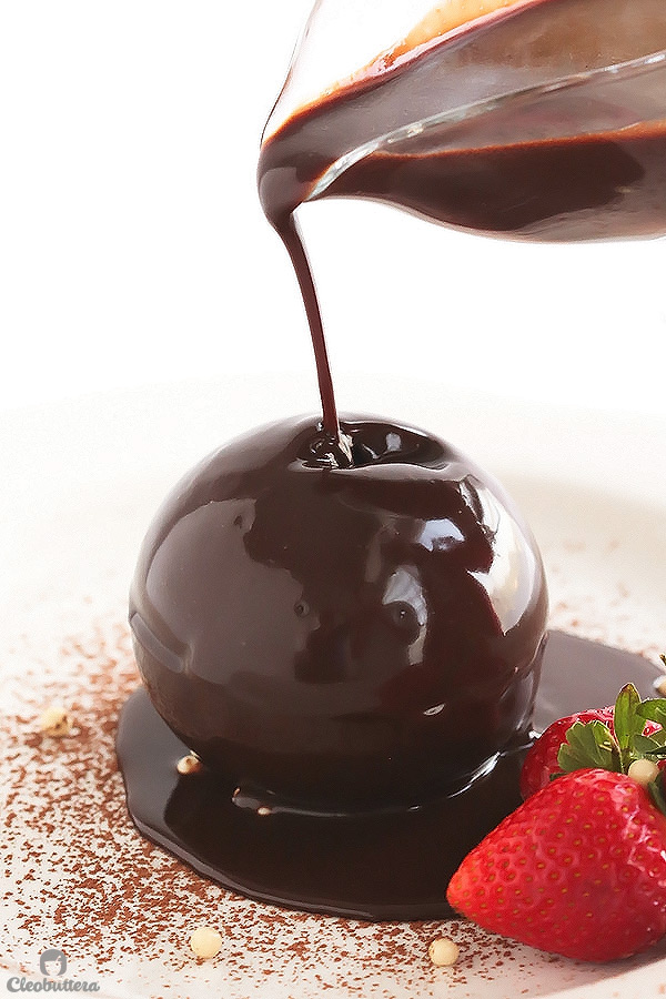 Collapsing Sphere of Hearts {A show-stopping chocolate sphere, magically filled with red velvet cake hearts. Beautifully collapses to the drizzle of warm Nutella sauce. 