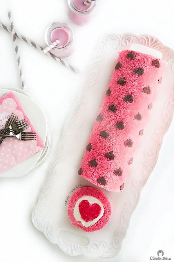 "Love is All Around" Cake Roll {Heart-patterned cake roll made easier with a CAKE MIX, filled with a cloud-like whipped cream cheese frosting, and unveils a cute heart with every slice}