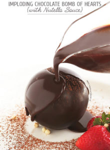 Imploding Chocolate Bomb of Hearts {A show-stopping chocolate sphere, magically filled with red velvet cake hearts. Beautifully collapses to the drizzle of warm Nutella sauce.
