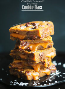 SALTED CARAMEL STUFFED COOKIE BARS {Browned butter chocolate chip cookie dough sandwiching a sinfully delicious, homemade salted caramel sauce}