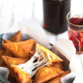 Three Cheese Samosas {A stringy, gooey mixture of mozzarella, and feta and cream cheese wrapped in a crunchy samosa dough pocket. Could be made with phyllo!}