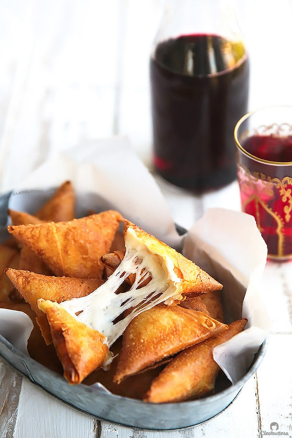 Three Cheese Samosas {A stringy, gooey mixture of mozzarella, and feta and cream cheese wrapped in a crunchy samosa dough pocket. Could be made with phyllo!}