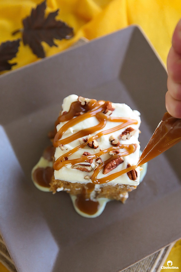 This superbly moist pumpkin spiced cake is so easy to make and always a big hit! Made from a revamped cake-mix, this cake oozes out with pockets of sweetened condensed milk, not-too-sweet caramel sauce, and smothered with clouds of caramel whipped cream and pecans. YUM!