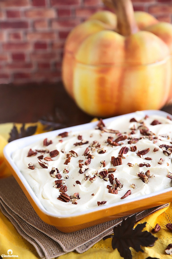 This superbly moist pumpkin spiced cake is so easy to make and always a big hit! Made from a revamped cake-mix, this cake oozes out with pockets of sweetened condensed milk, not-too-sweet caramel sauce, and smothered with clouds of caramel whipped cream and pecans. YUM!