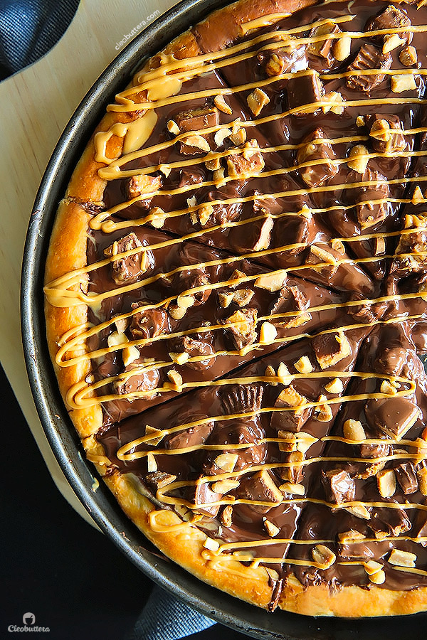 A dessert pizza on peanut butter steroids! Soft pizza crust, melted chocolate, chopped Reese's, salted peanuts and a peanut butter drizzle. YUM!