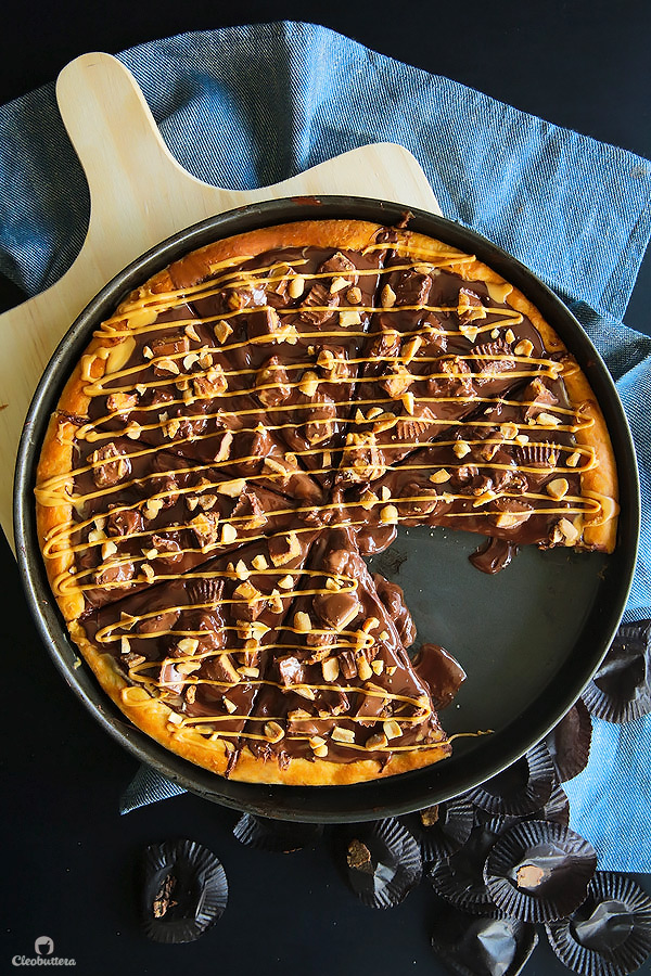 A dessert pizza on peanut butter steroids! Soft pizza crust, melted chocolate, chopped Reese's, salted peanuts and a peanut butter drizzle. YUM!