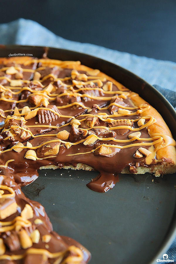 A dessert pizza on peanut butter steroids! Soft pizza crust, melted chocolate, chopped Reese's, salted peanuts and a peanut butter drizzle. YUM!