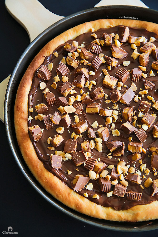 A dessert pizza on peanut butter steroids! Soft pizza crust, melted chocolate, chopped Reese's, salted peanuts and a peanut butter drizzle. YUM!