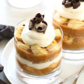 The much loved banana toffee pie made even simpler in cute little individual cups! With layers of digestive biscuit crust, dulce de leche, banana slices and whipped cream, this no-bake “pie” is dangerously delicious and a cinch to make!