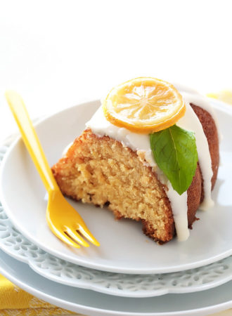 This quadruple lemon bundt cake is as lemony as it gets! A tender sour cream cake is filled with bursts of lemon zest, then brushed with lemon syrup, glazed with lemon cream cheese icing and adorned with candied lemon slices. It’s melt-in-the-mouth refreshing (Poppy seeds are more than welcome here!)
