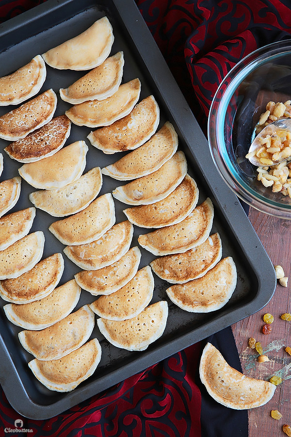 A Middle Eastern favorite, traditionally served during the month of Ramadan! Made from a type of yeasted pancakes stuffed with nuts, fried to crunchy, golden perfection, then doused in simple syrup.