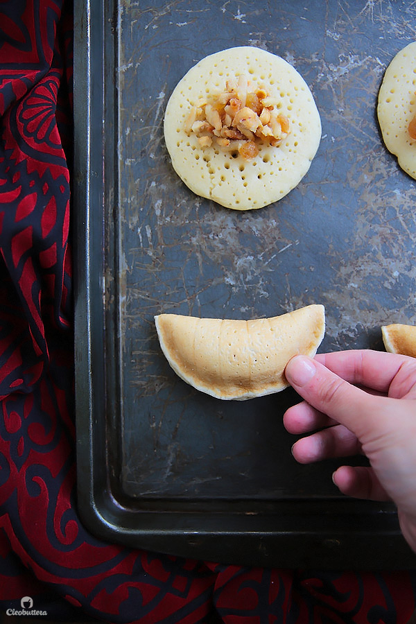 A Middle Eastern favorite, traditionally served during the month of Ramadan! Made from a type of yeasted pancakes stuffed with nuts, fried to crunchy, golden perfection, then doused in simple syrup.