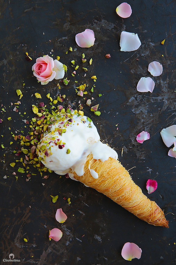 The classic cream konafa just got ice cream-ized! Crunchy, sweetened konafa cones served with a no-churn rose and orange blossom water scented eshta ice cream