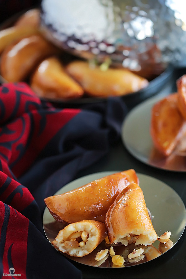 A Middle Eastern favorite, traditionally served during the month of Ramadan! Made from a type of yeasted pancakes stuffed with nuts, fried to crunchy, golden perfection, then doused in simple syrup.