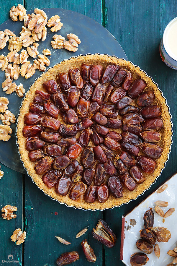 This tart could not be easier or more delicious! Cinnamon spiced digestive biscuit crust, layered with soft dates, walnuts and caramelized condensed milk. Heavenly!