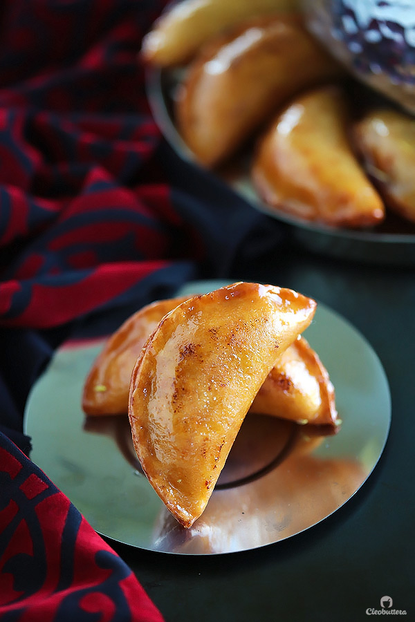 A Middle Eastern favorite, traditionally served during the month of Ramadan! Made from a type of yeasted pancakes stuffed with nuts, fried to crunchy, golden perfection, then doused in simple syrup.