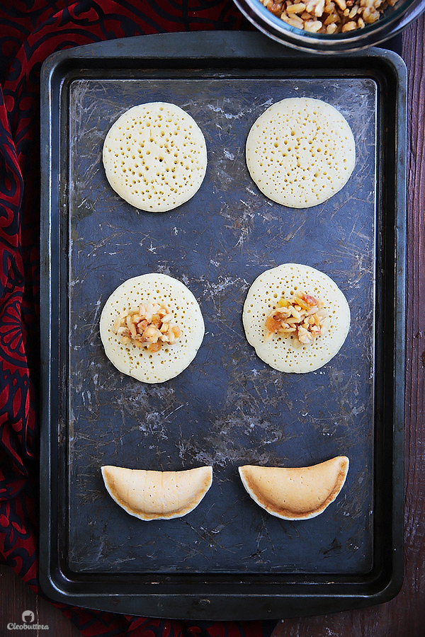 A Middle Eastern favorite, traditionally served during the month of Ramadan! Made from a type of yeasted pancakes stuffed with nuts, fried to crunchy, golden perfection, then doused in simple syrup.