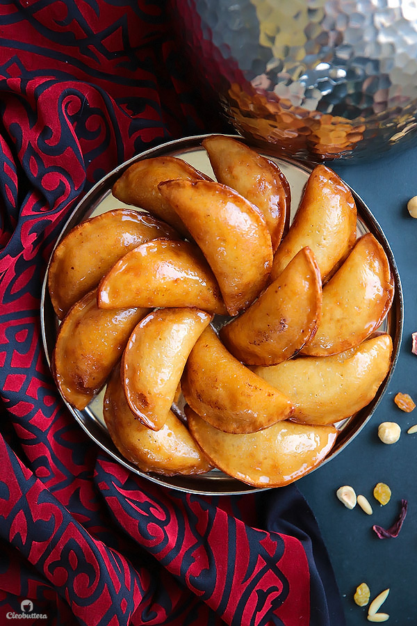 A Middle Eastern favorite, traditionally served during the month of Ramadan! Made from a type of yeasted pancakes stuffed with nuts, fried to crunchy, golden perfection, then doused in simple syrup.