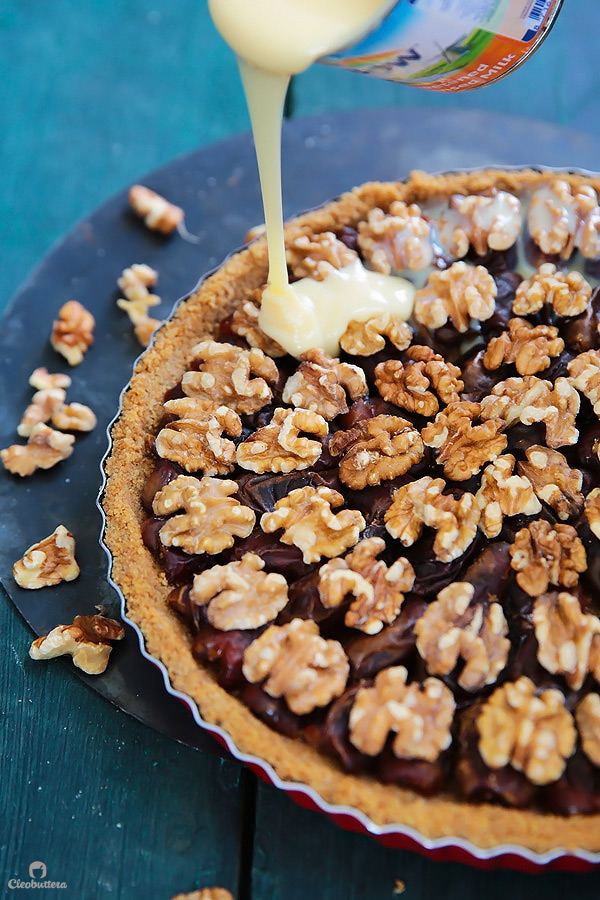 This tart could not be easier or more delicious! Cinnamon spiced digestive biscuit crust, layered with soft dates, walnuts and caramelized condensed milk. Heavenly!