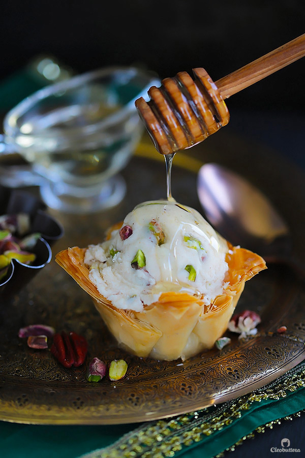 A fun summer spin on the Mediterranean favorite! Crispy phyllo cup sweetened with cinnamon honey syrup, topped with a scoop of an easy to make candied nuts cinnamon ice cream. 