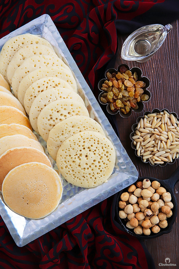 A Middle Eastern favorite, traditionally served during the month of Ramadan! Made from a type of yeasted pancakes stuffed with nuts, fried to crunchy, golden perfection, then doused in simple syrup.