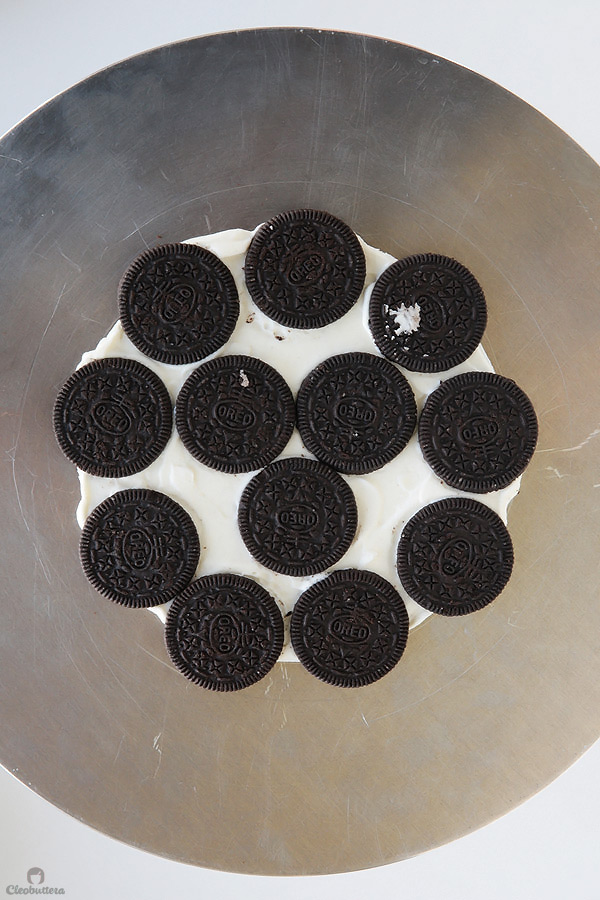 Alternating layers of Oreos and Oreo filling-flavored whipped cream make up for one incredibly EASY and delicious cake! This NO BAKE dessert, soften as it sits in the refrigerator and transforms into a cake that tastes like a cross between a giant soft Oreo and an ice cream sandwich. SO GOOD!