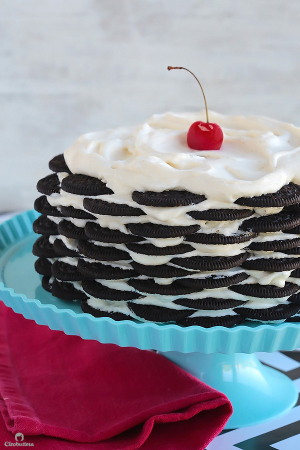 Alternating layers of Oreos and Oreo filling-flavored whipped cream make up for one incredibly EASY and delicious cake! This NO BAKE dessert, soften as it sits in the refrigerator and transforms into a cake that tastes like a cross between a giant soft Oreo and an ice cream sandwich. SO GOOD!