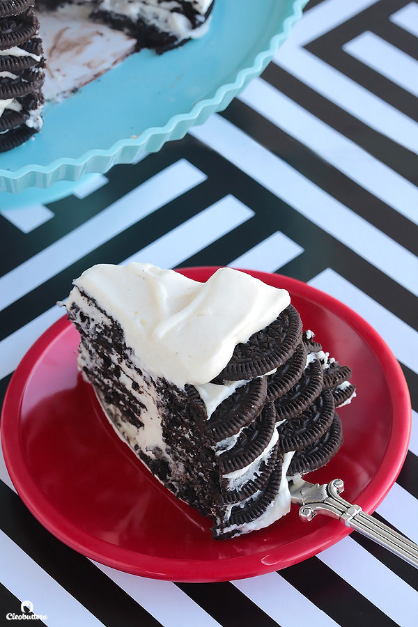 Alternating layers of Oreos and Oreo filling-flavored whipped cream make up for one incredibly EASY and delicious cake! This NO BAKE dessert, soften as it sits in the refrigerator and transforms into a cake that tastes like a cross between a giant soft Oreo and an ice cream sandwich. SO GOOD!