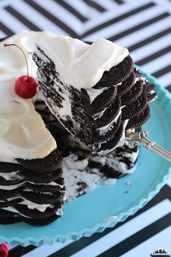 Alternating layers of Oreos and Oreo filling-flavored whipped cream make up for one incredibly EASY and delicious cake! This NO BAKE dessert, soften as it sits in the refrigerator and transforms into a cake that tastes like a cross between a giant soft Oreo and an ice cream sandwich. SO GOOD!