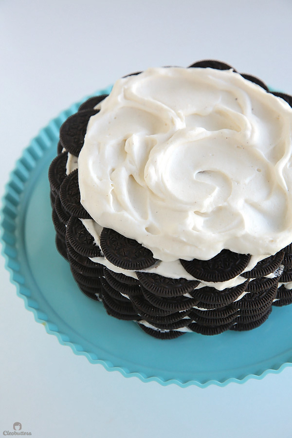 Alternating layers of Oreos and Oreo filling-flavored whipped cream make up for one incredibly EASY and delicious cake! This NO BAKE dessert, soften as it sits in the refrigerator and transforms into a cake that tastes like a cross between a giant soft Oreo and an ice cream sandwich. SO GOOD!