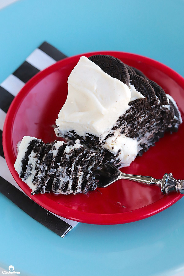 Alternating layers of Oreos and Oreo filling-flavored whipped cream make up for one incredibly EASY and delicious cake! This NO BAKE dessert, soften as it sits in the refrigerator and transforms into a cake that tastes like a cross between a giant soft Oreo and an ice cream sandwich. SO GOOD!