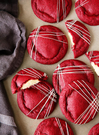Get your Red Velvet Cake (frosting and all) in cookie form! These irresistibly soft and chewy red velvet cookies stuffed with real deal cream cheese frosting, are pretty amazing!