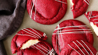 Get your Red Velvet Cake (frosting and all) in cookie form! These irresistibly soft and chewy red velvet cookies stuffed with real deal cream cheese frosting, are pretty amazing!