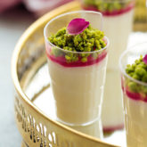 Arabic style milk pudding infused with a touch of rose and orange blossom waters, adorned with rose syrup topping and garnished with caramelized pistachios. Talk about eye candy! Plus...recipe VIDEO included!