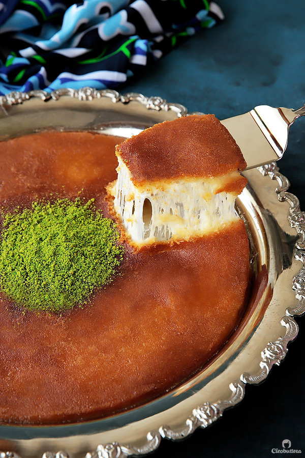 A perfected homemade version of the Levant specialty!  Delicately crunchy smooth knafeh crust, cradling a molten layer of ooegy gooey cheese.  A drizzle of scented sugar syrup, adds the finishing sweet touch to the classic favorite!  Plus...recipe VIDEO included!