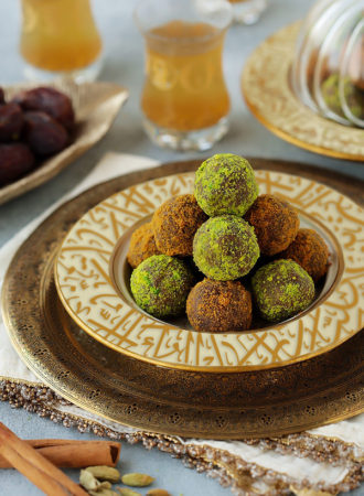 Delightfully soft date balls studded with crunchy chunks of biscuits and flavored with warm spices.  Make them with Lotus biscuits for that caramelized gingerbread flavor it's loved for, or Digestive biscuits and cardamom to go with that perfect cup of Arabic coffee.
